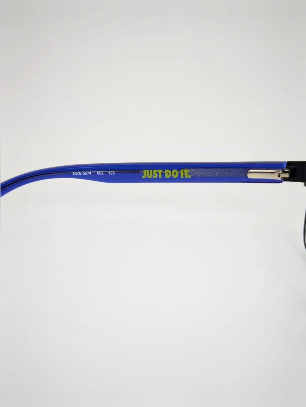 Nike Youth. Black metal front, Royal Blue Temples With Lime Green Swoosh.